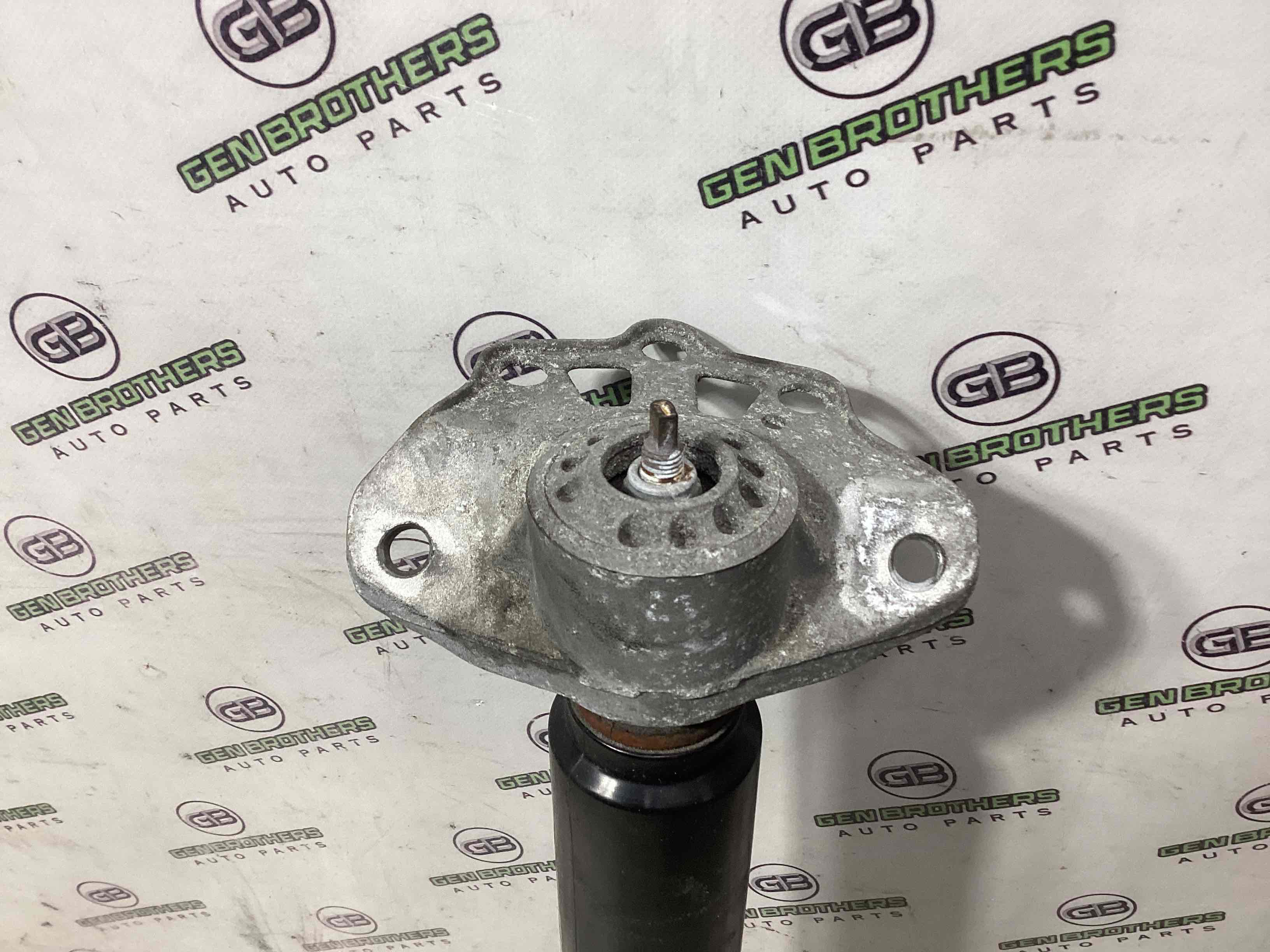 Амортизатор задній лівий