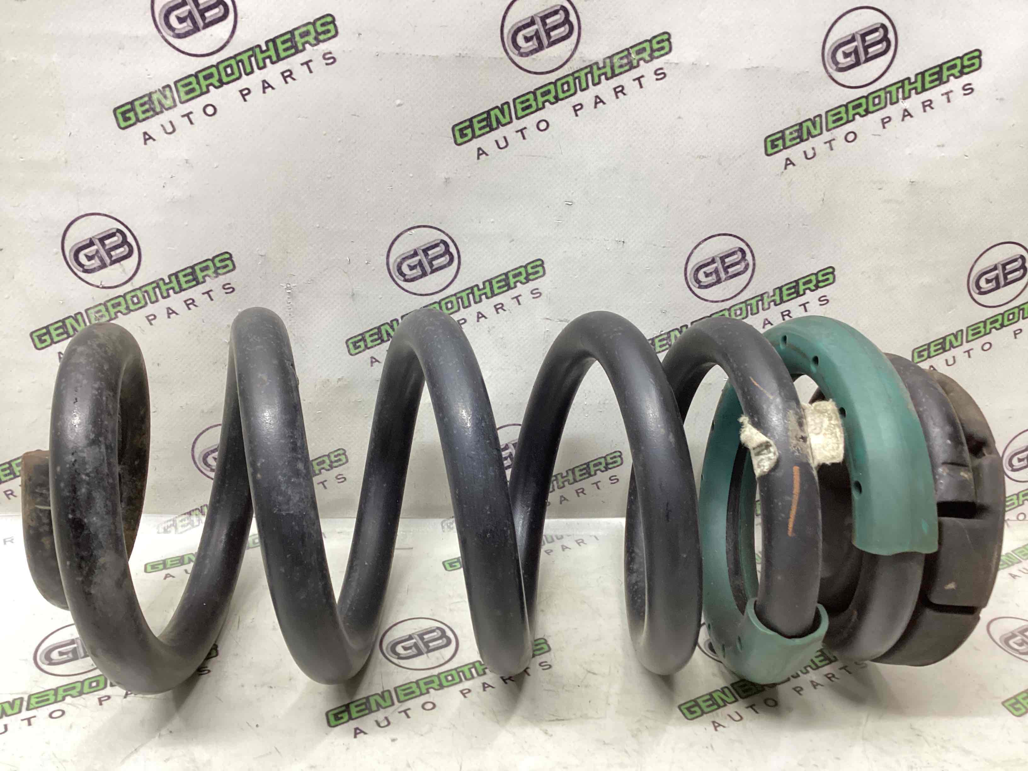 Пружина задняя