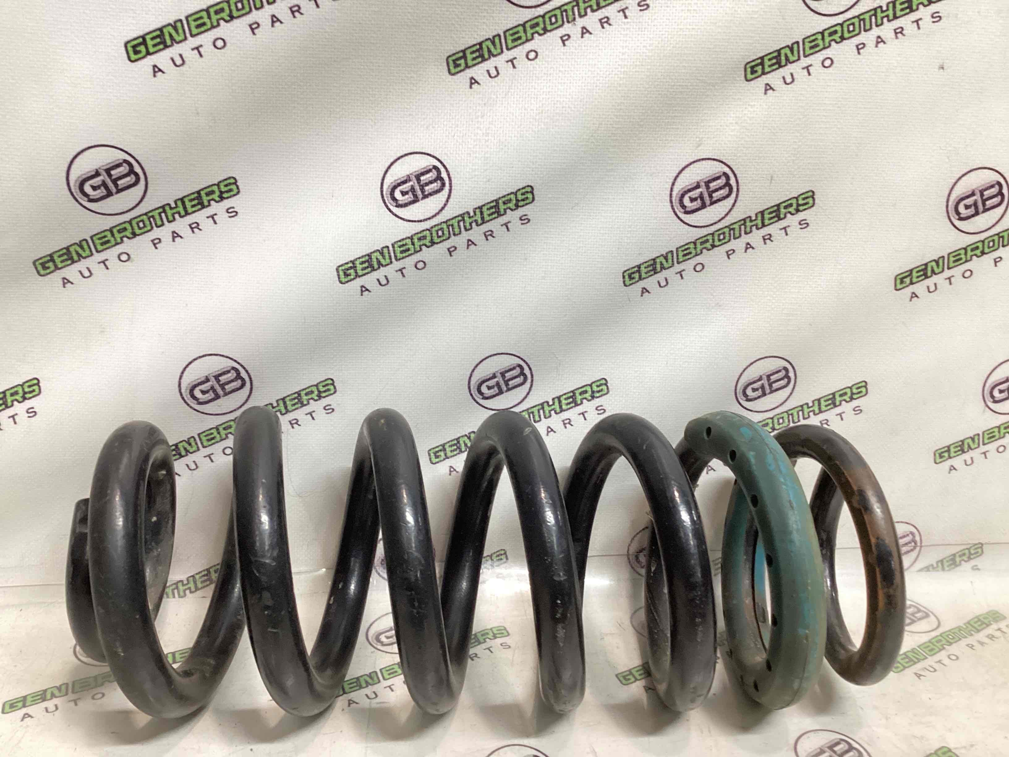 Пружина задня