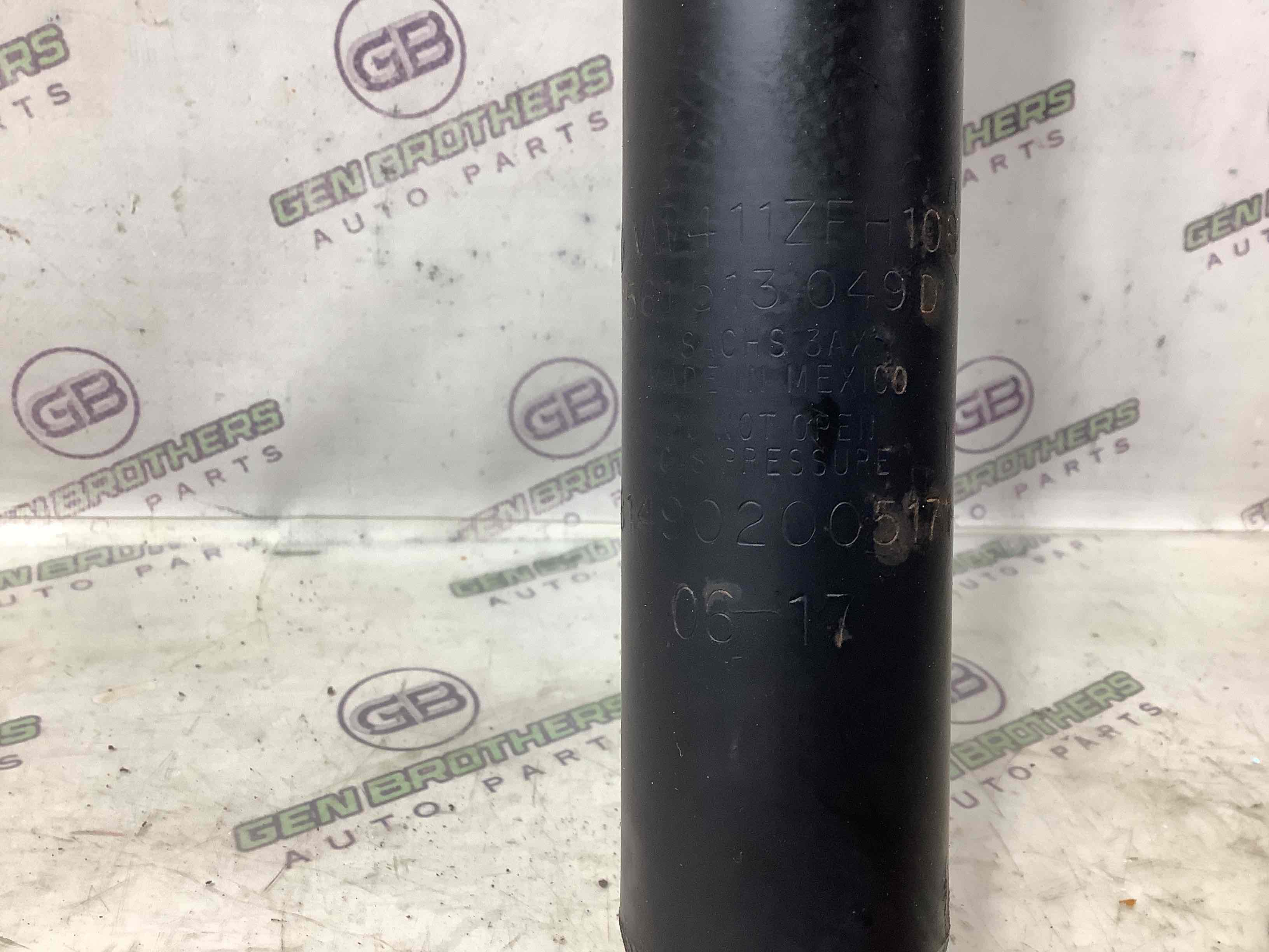 Амортизатор задній лівий